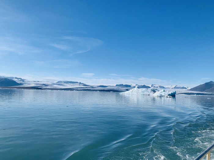 Scenic view of sea against blue sky