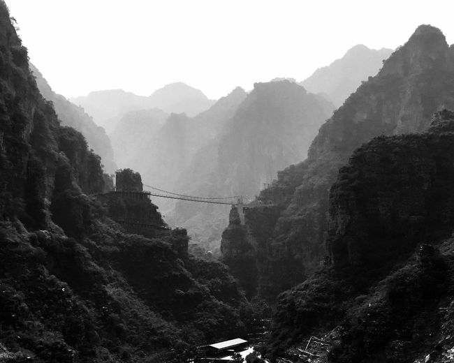 Scenic view of mountains in foggy weather