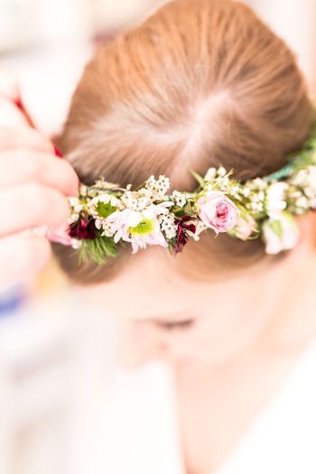 Close-up of bride wearing floral crown