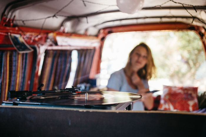 Woman listening to turntable