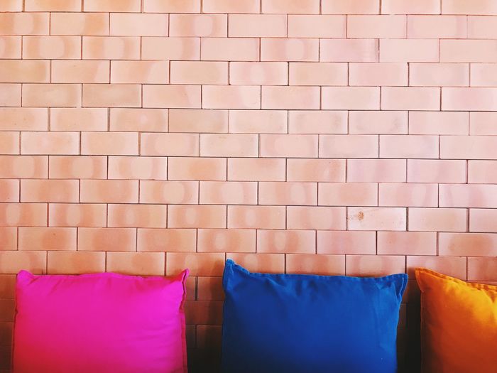 View of cushions by wall at home