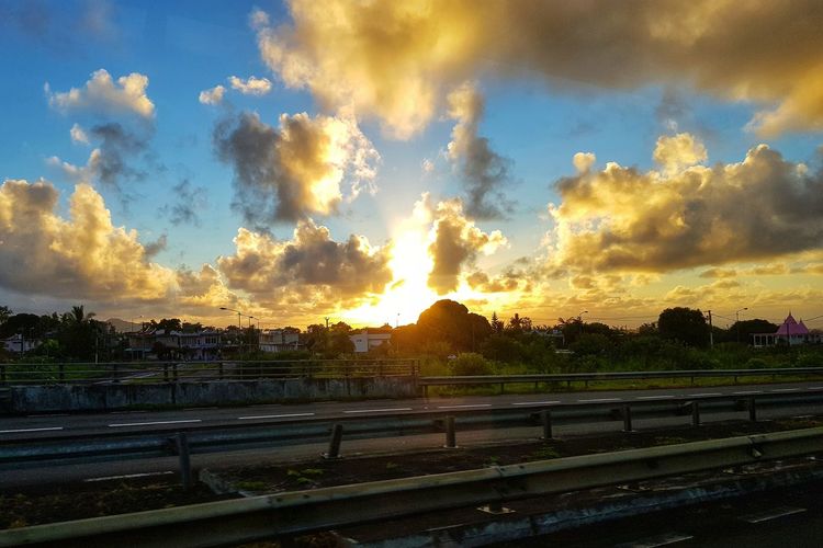 Panoramic view of road against sky during sunset