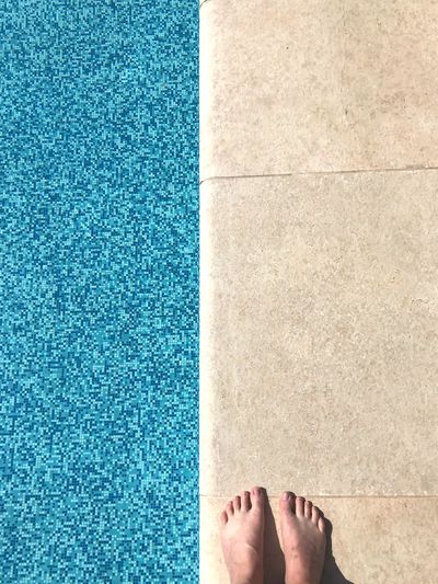 Low section of person at poolside