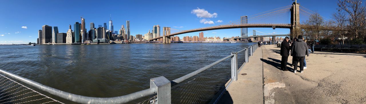 View of bridge over river in city
