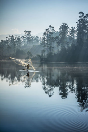 People are fishing at the morning with a beautiful scenery