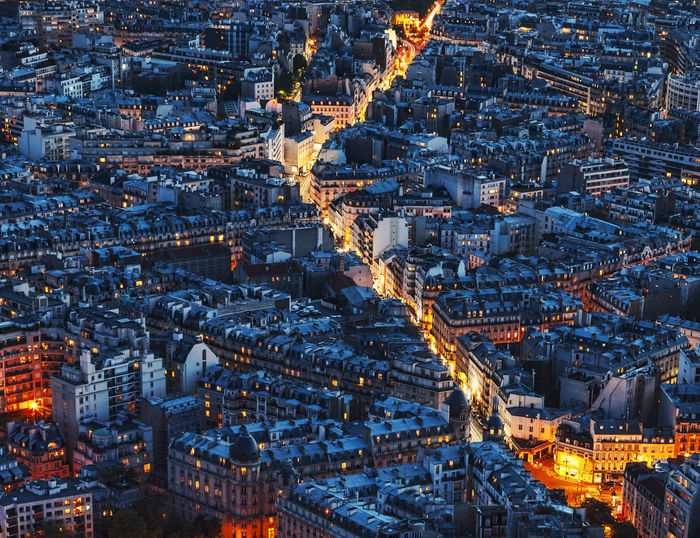 Aerial view of illuminated cityscape at dusk