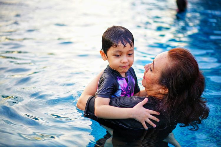 Mother and son in swimming pool