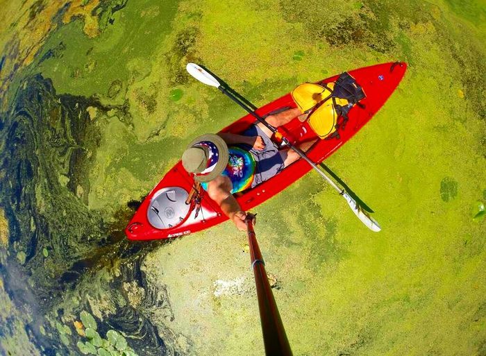 Directly above shot of man kayaking in lake