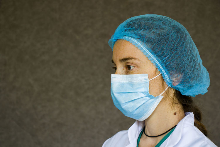 Woman doctors portrait, doctors with mask, glove and uniform. uniform for surgery and viruses.