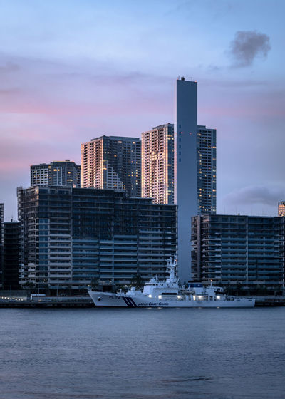View of modern buildings in city against sky