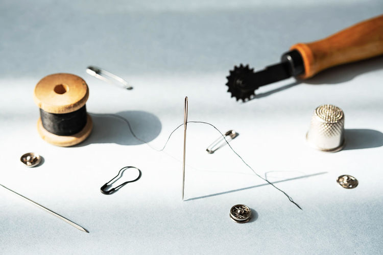 Stitching tools. various tailoring instruments. needlework hobby concept.