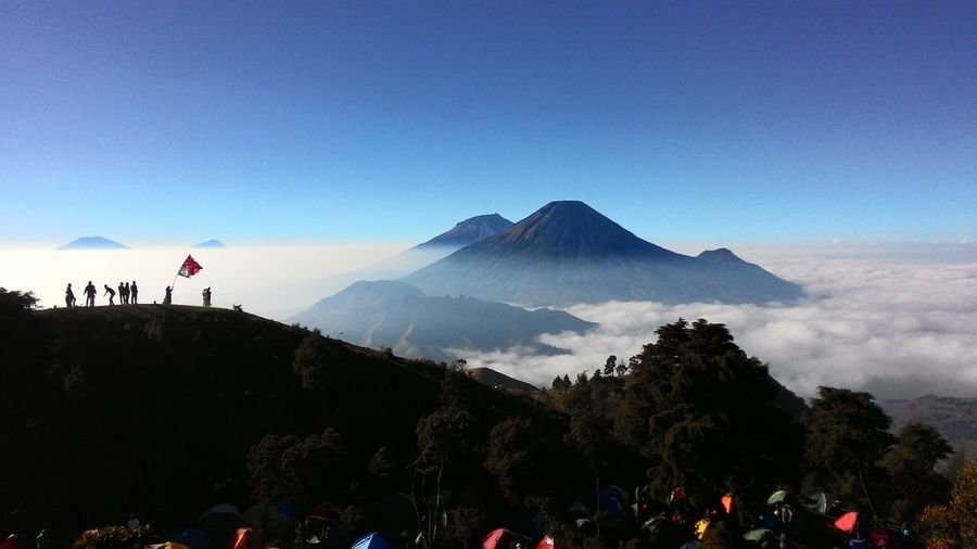 Scenic view of mount prau against clear blue sky