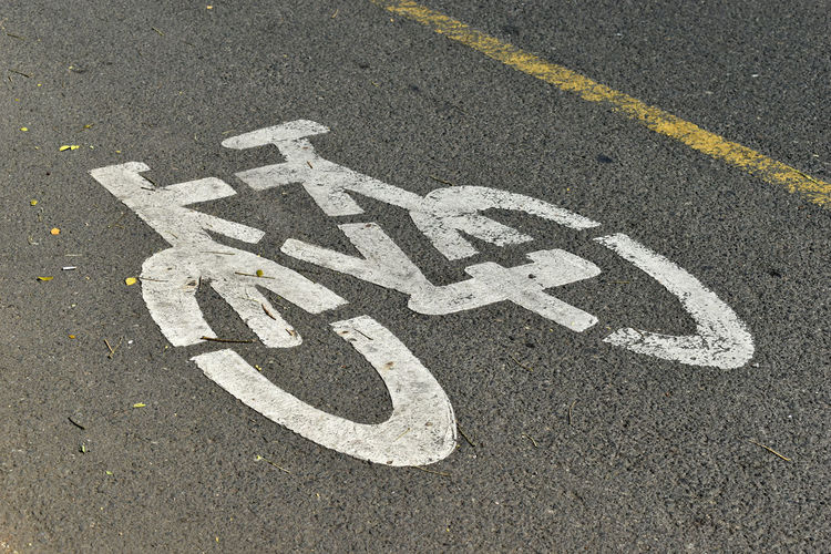 High angle view of bicycle lane sign on street