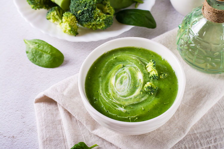 Bowl with broccoli cream soup on the table. healthy food.