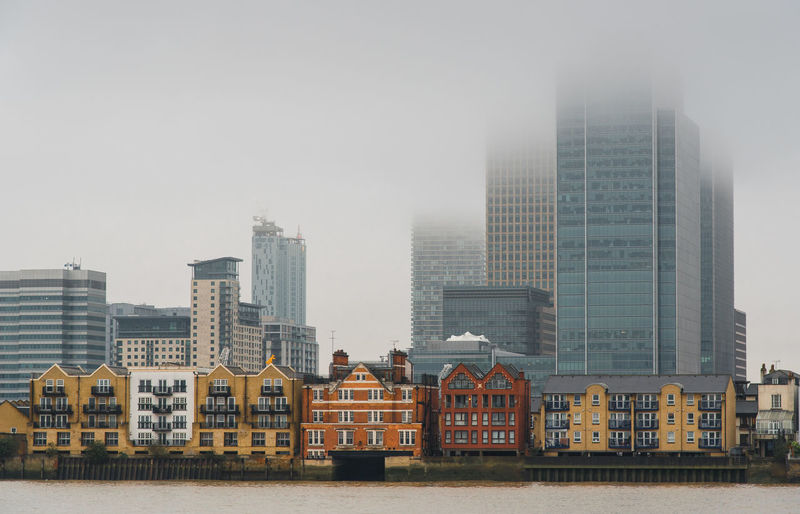 Modern office buildings in city against sky