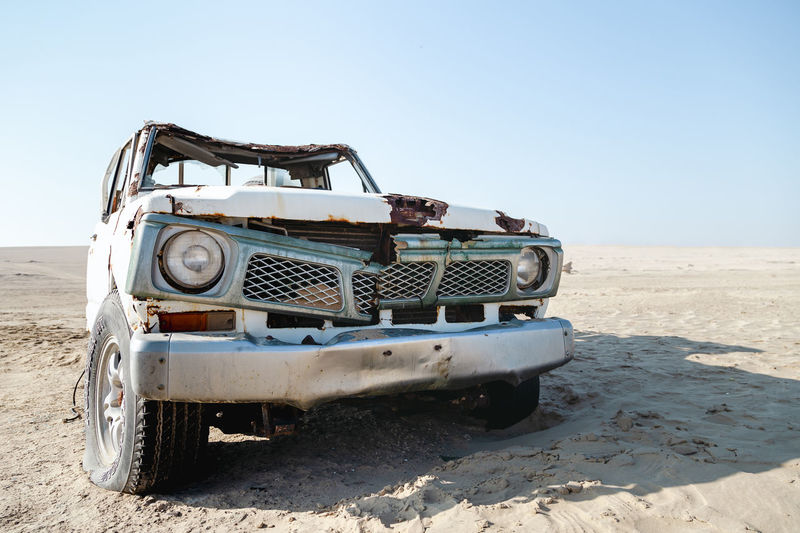 An old abandoned car in the desert in uae