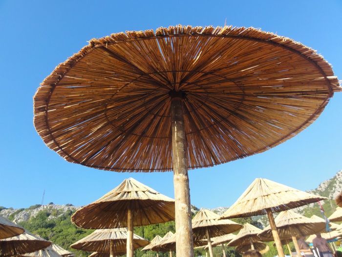 Big sun shade umbrella against clear sky