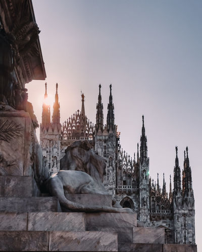Low angle view of temple, duomo of milan against clear sky