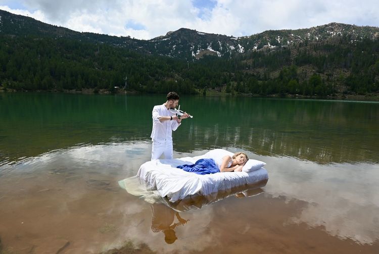 Woman sitting on a lake