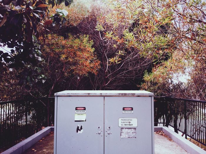 Meter board against trees