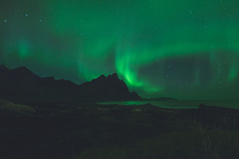 Scenic view of aurora against sky at night