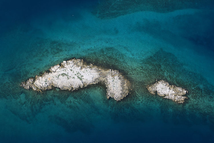 Barren islet in adriatic sea near krk island, croatia