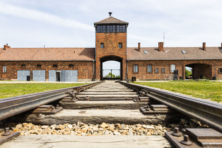 The main entrance to the auschwitz-birkenau concentration camp. oswiecim, poland, 16 may 2022