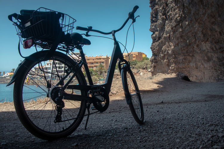 Bicycle parked against wall
