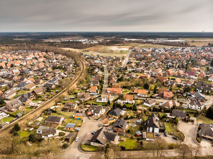 Aerial photos of a village in germany crossed by a single-track railway line 