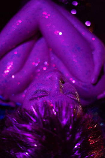 cropped hand of woman with christmas tree