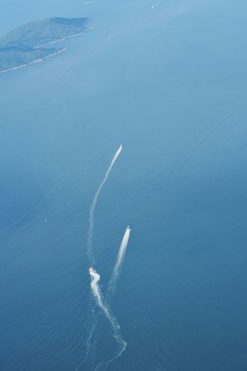 High angle view of sea against blue sky