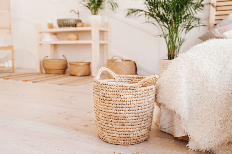 Light interior made of natural eco components. wicker straw basket for clothes