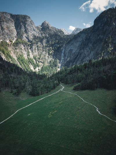 Scenic view of landscape and mountains against sky
