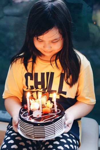 Close-up of girl with birthday cake