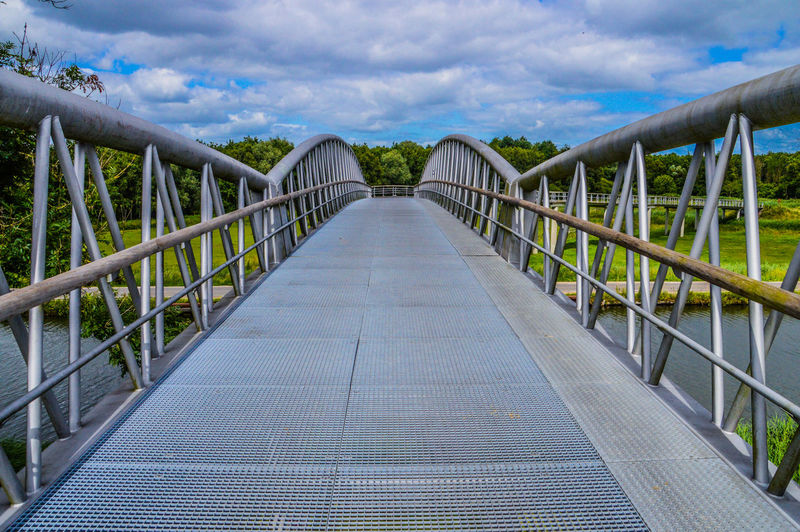 View of footbridge against sky