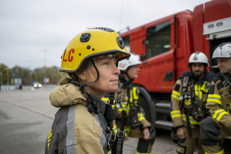 Female firefighter looking away