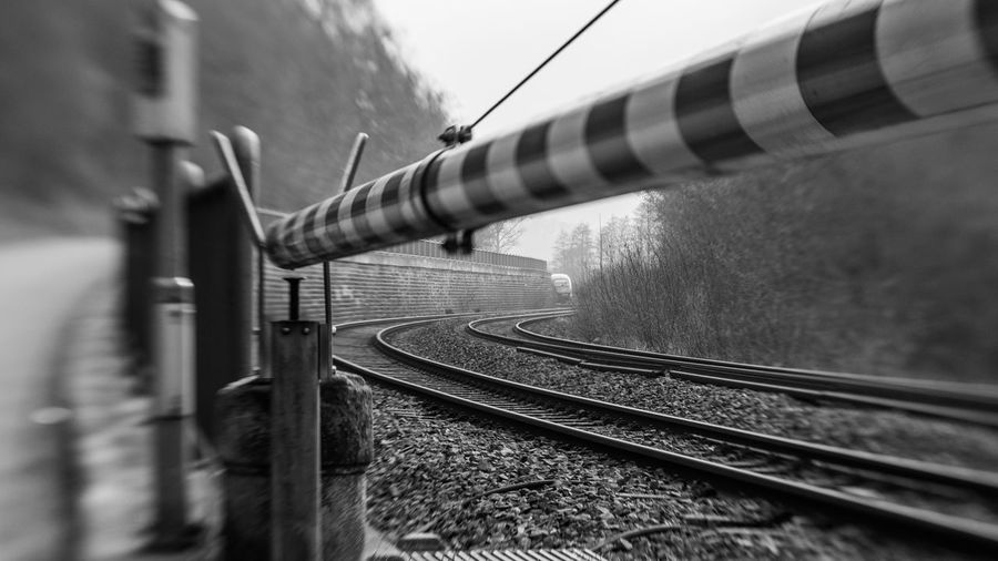 Train on railroad track against sky