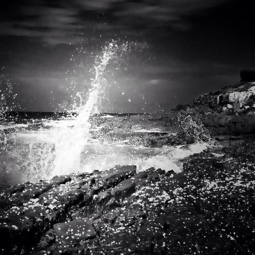 Waves splashing on rocks