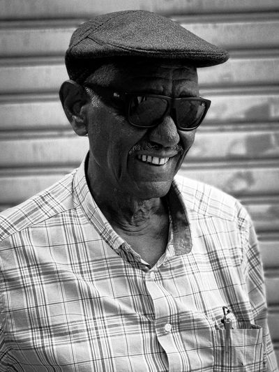 Portrait of old man wearing hat