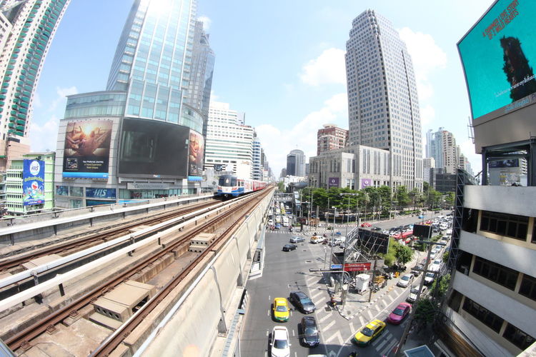 High angle view of railway line amidst buildings in city