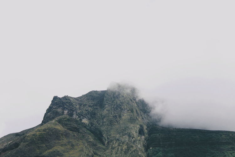 Foggy portrait of rocky mountain