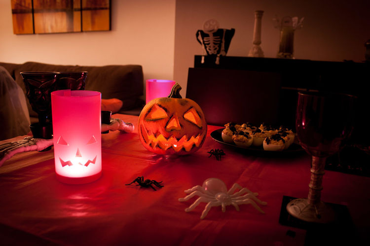 View of illuminated candles on table at home