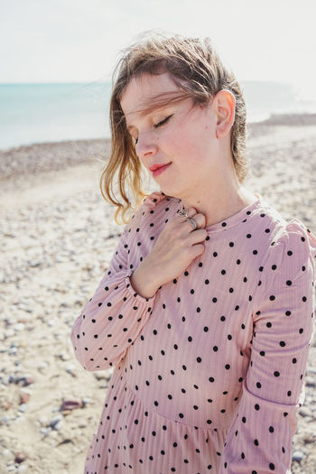 Woman standing on beach