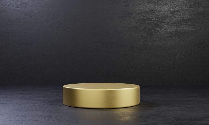 Close-up of tea cup on table against wall