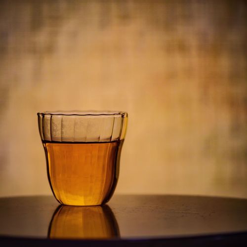 Close-up of tea in glass on table