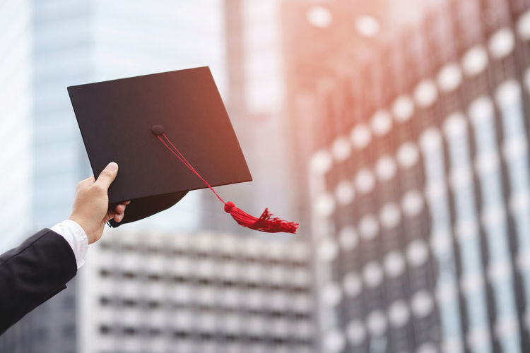 Shot of graduation hats during commencement success graduates 