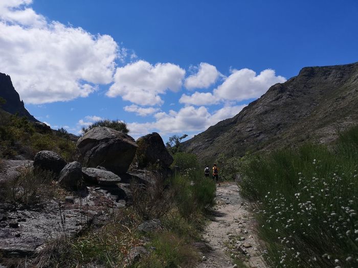 Panoramic shot of people on land against sky