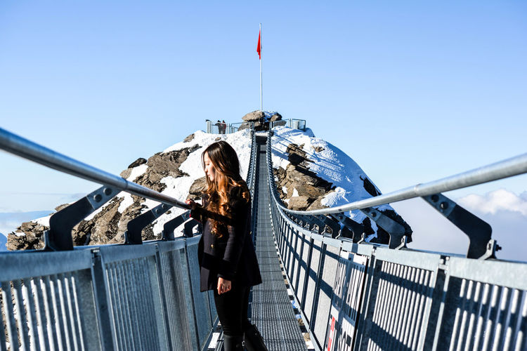 Woman on bridge in switzerland