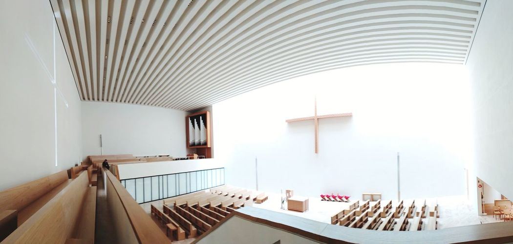 High angle view of empty pews in church