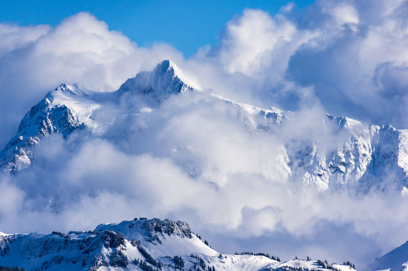 Majestic view of snowcapped mt shuksan against cloudy sky